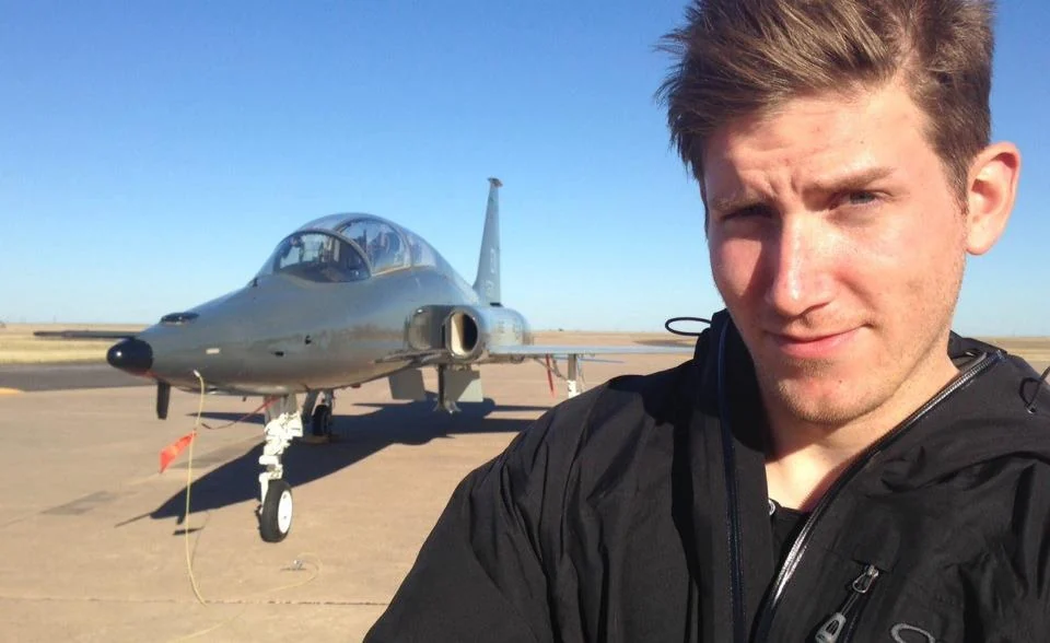 Jeff Mackey on location beside an aircraft